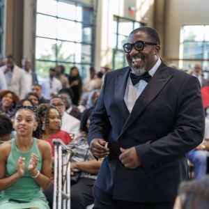 Man in tuxedo laughing