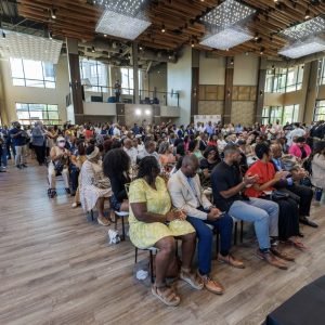 Large audience seated in beautiful room